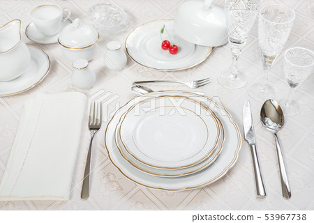 Two cherries lie on a white porcelain plate Two cherries lie on a white porcelain plate 53967738