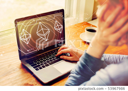 Ethereum with man using a laptop Ethereum with man using a laptop 53967986