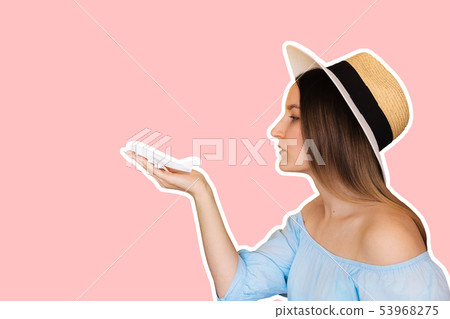 Young woman launches a plane with hands Young woman launches a plane with hands 53968275