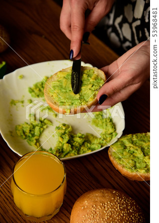 Making avocado toast on the home kitchen Making avocado toast on the home kitchen 53968481