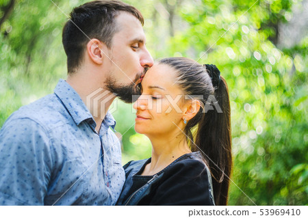 Outdoor portrait of a couple in love Outdoor portrait of a couple in love 53969410