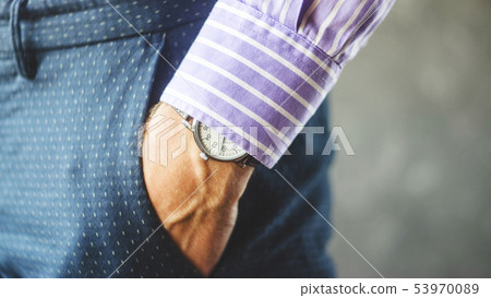 Male Hand in Pants Pocket with Wristwatch 53970089