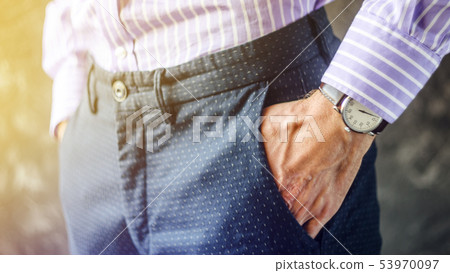 Male Hand in Pants Pocket with Wristwatch 53970097