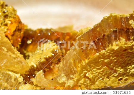 Honeycomb close-up material background right after taking out from bee box 53971625