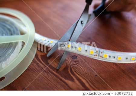 cutting off unnecessary pieces of LED tape 53972732
