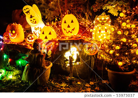 Scary halloween decorations outdoors at night close up Scary halloween decorations outdoors at night close up 53973037