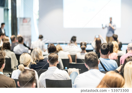 Male business speaker giving a talk at business conference event. 53973300