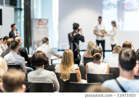 Young business team receiving award at best business project competition event. 53973303