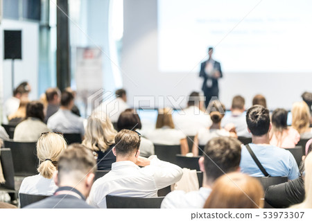Male business speaker giving a talk at business conference event. Male business speaker giving a talk at business conference event. 53973307