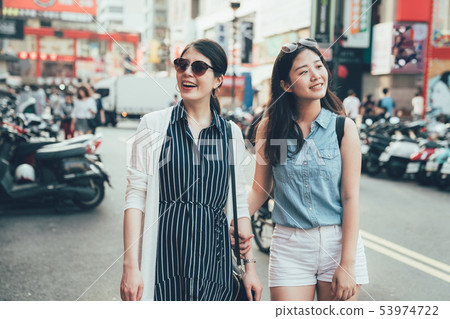 travelers walking on street shopping 53974722