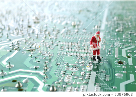 Santa Claus giving out Christmas presents on the base of a PC Santa Claus giving out Christmas presents on the base of a PC 53976968