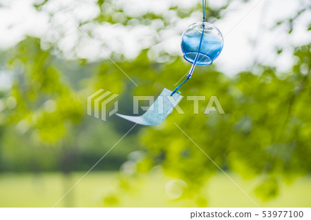 Blue wind bell swaying in the wind Blue wind bell swaying in the wind 53977100