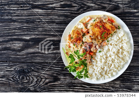 chicken fricassee on a white plate, flatlay 53978344