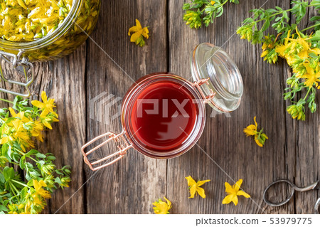 Red oil made from St. John's wort flowers, top 53979775