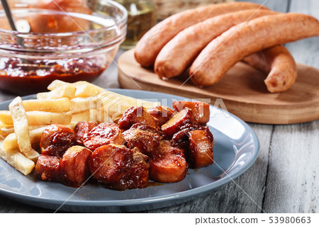 Traditional German currywurst - pieces of sausage Traditional German currywurst - pieces of sausage 53980663