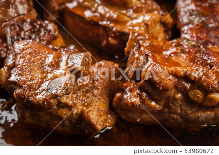 Pork spare ribs on dish in own sauce Pork spare ribs on dish in own sauce 53980672