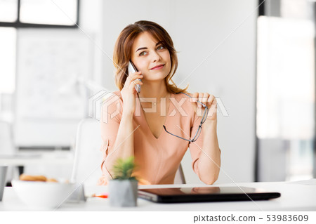 businesswoman calling on smartphone at office 53983609