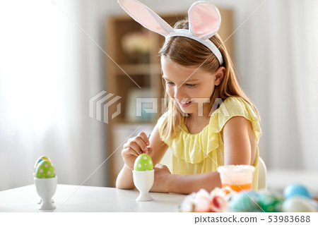 happy girl coloring easter egg at home happy girl coloring easter egg at home 53983688