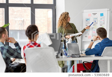 creative woman showing user interface at office creative woman showing user interface at office 53983689