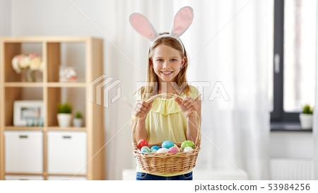happy girl with colored easter eggs at home happy girl with colored easter eggs at home 53984256