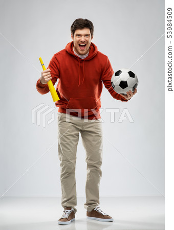 man or football fan with soccer ball and vuvuzela 53984509