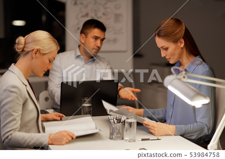 business team with laptop working at night office business team with laptop working at night office 53984758
