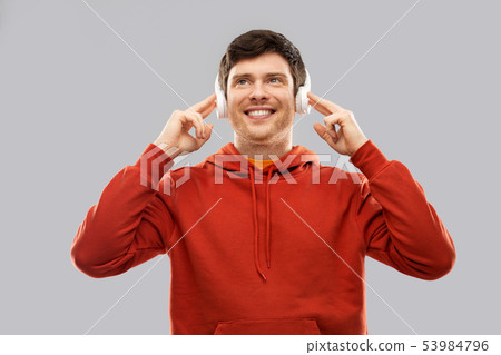 happy young man in headphones and red hoodie happy young man in headphones and red hoodie 53984796