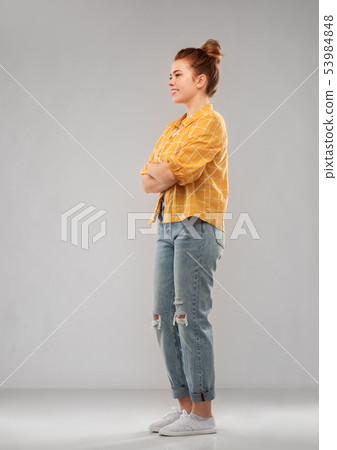 red haired teenage girl in shirt and torn jeans red haired teenage girl in shirt and torn jeans 53984848