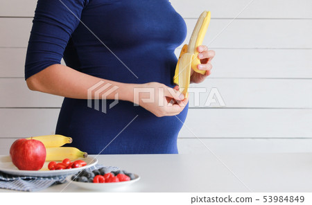 Pregnant woman eat vegetable salad, fruit 53984849