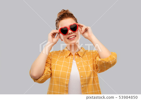 red haired teenage girl in heart-shaped sunglasses red haired teenage girl in heart-shaped sunglasses 53984850