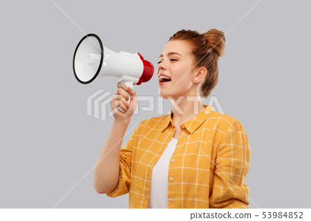 red haired teenage girl speaking to megaphone red haired teenage girl speaking to megaphone 53984852