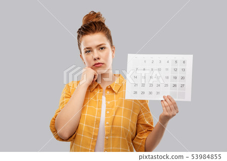 sad red haired teenage girl with calendar sheet sad red haired teenage girl with calendar sheet 53984855