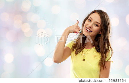 young woman or teenage girl showing call gesture young woman or teenage girl showing call gesture 53985264