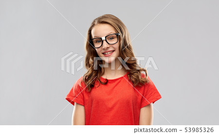 smiling student girl in glasses and red t-shirt smiling student girl in glasses and red t-shirt 53985326