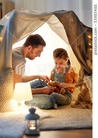 happy family playing with toy in kids tent at home happy family playing with toy in kids tent at home 53985488