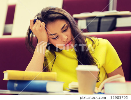 student girl with books and coffee on lecture student girl with books and coffee on lecture 53985795