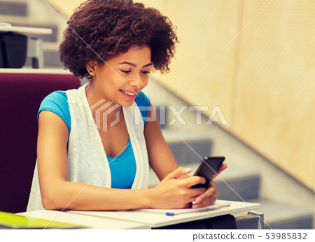african student girl with smartphone on lecture african student girl with smartphone on lecture 53985832