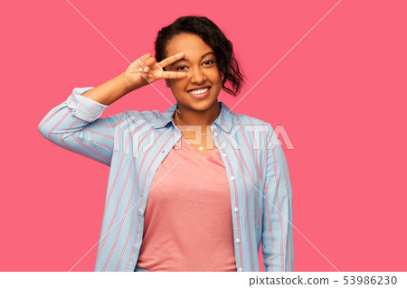 happy african american woman showing peace 53986230
