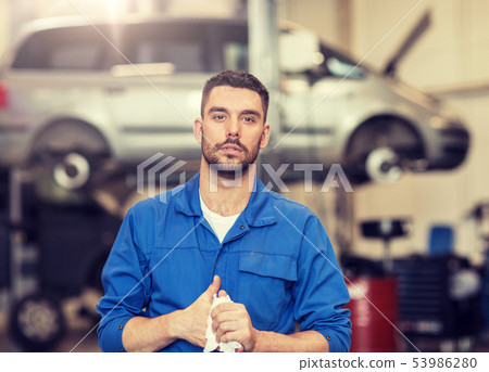 auto mechanic man or smith at car workshop 53986280