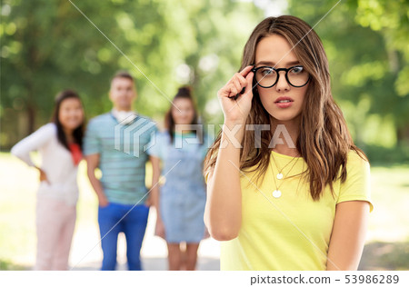 young woman or teenage girl in glasses 53986289