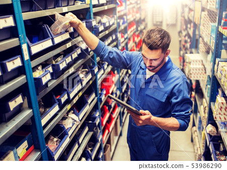 auto mechanic or smith with tablet pc at workshop 53986290