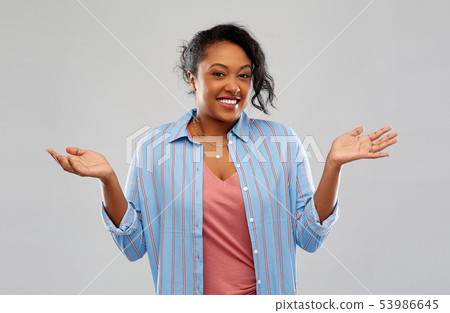 clueless african american woman shrugging 53986645