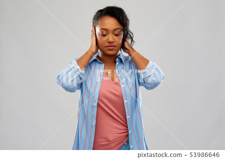 african american woman closing ears by hands african american woman closing ears by hands 53986646