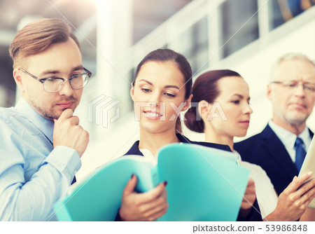 business team with folders meeting at office business team with folders meeting at office 53986848