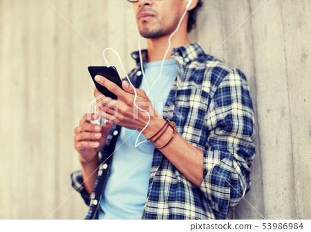 man with earphones and smartphone listening music man with earphones and smartphone listening music 53986984