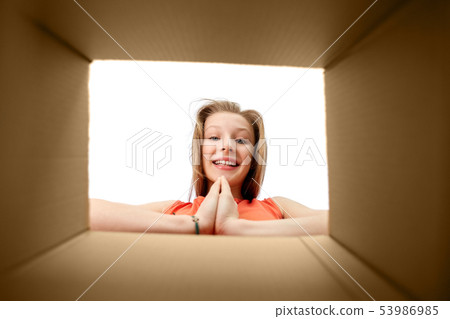 happy girl looking into open gift box happy girl looking into open gift box 53986985