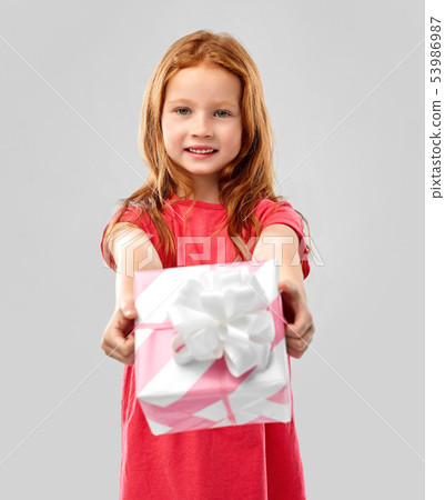 lovely red haired girl with birthday gift 53986987