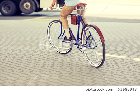 hipster man riding fixed gear bike hipster man riding fixed gear bike 53986988