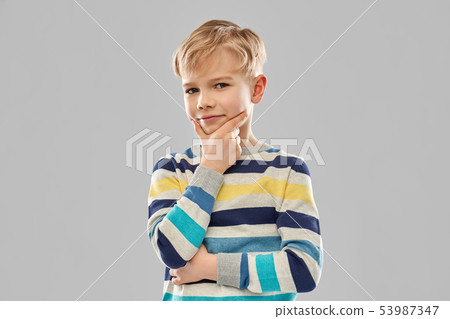 portrait of thinking boy in striped pullover portrait of thinking boy in striped pullover 53987347