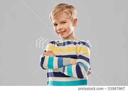 smiling boy in striped pullover with crossed arms smiling boy in striped pullover with crossed arms 53987967